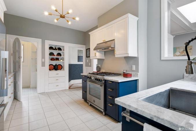 Property Thumbnail: View of the kitchen, showing built-in white cabinets along one wall