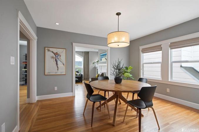 Property Thumbnail: View of the dining room, featuring wood floors and two large windows