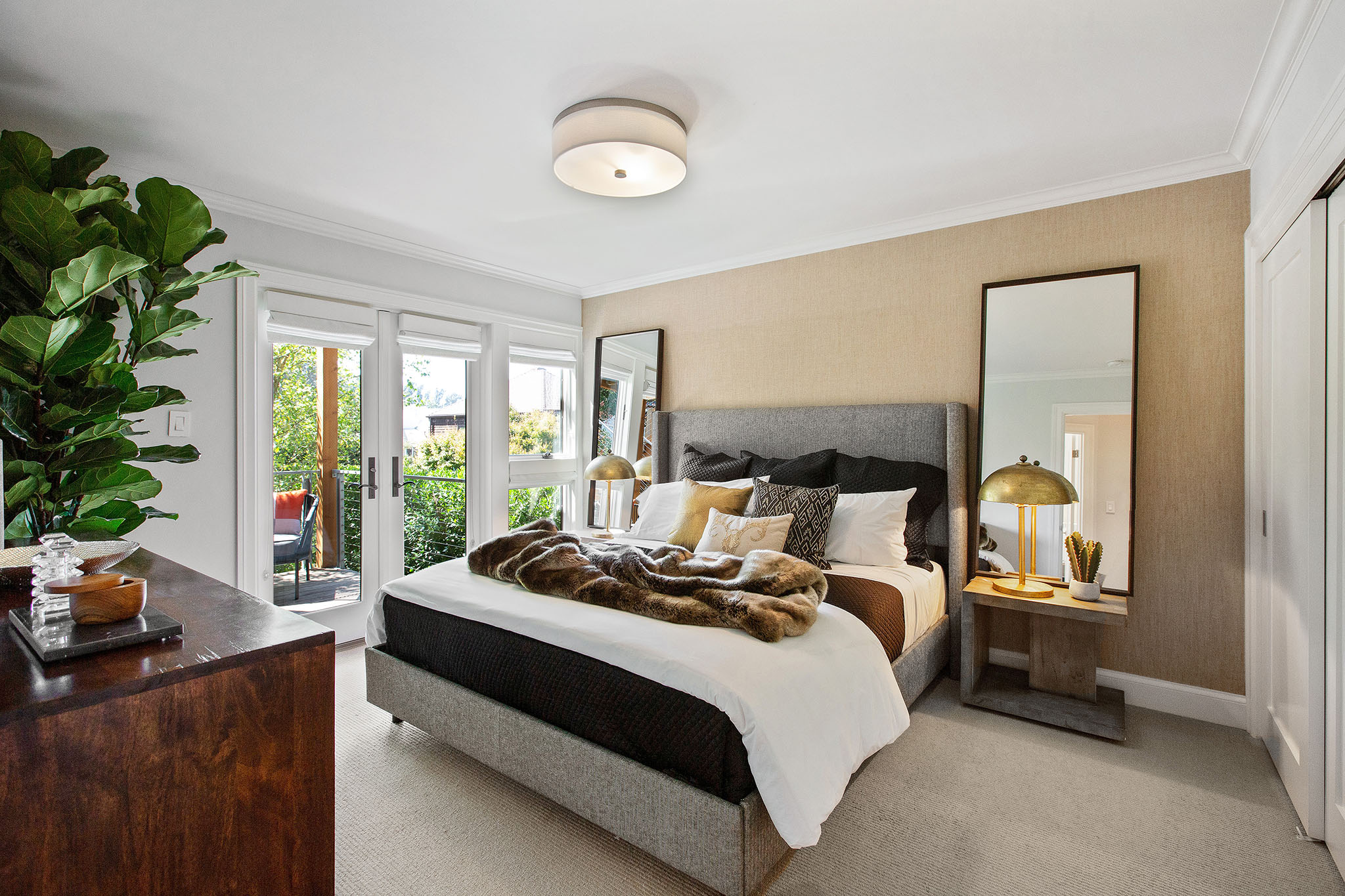 Property Photo: View of a bedroom with large French doors leading outside