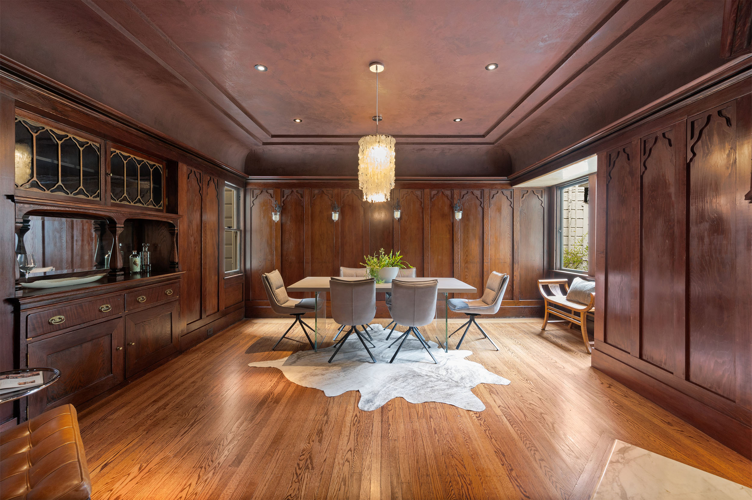 View of a elegant wood paneled dining room developed by San Francisco icon, Mary A. Fritz