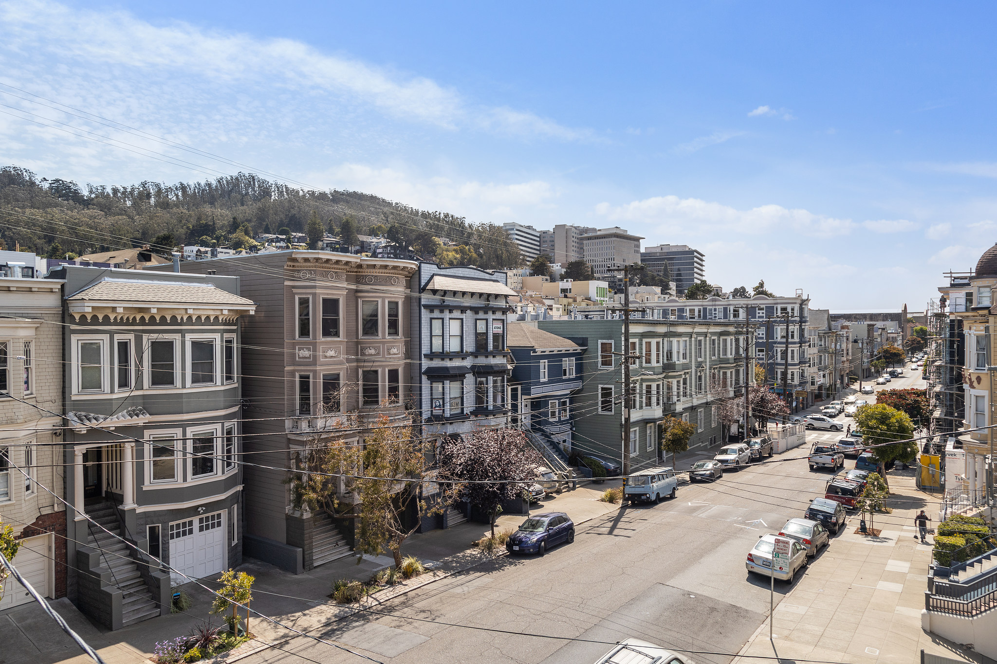 A street lined with three story houses in San Francisco