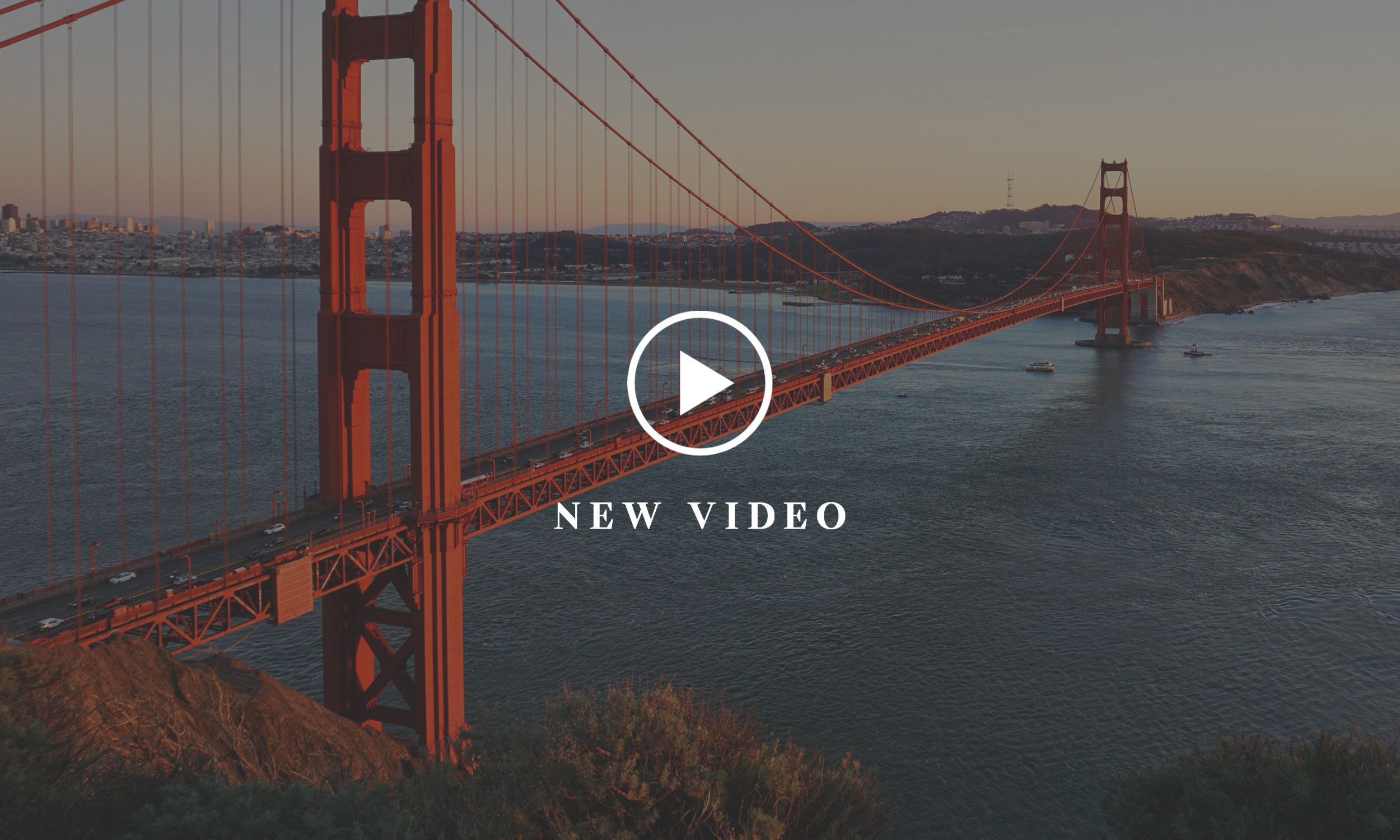 View of the Golden Gate Bridge with video button overlay
